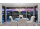 Dining area at dusk with views of the city skyline at 3111 Bel Air Dr # 21A & 21C, Las Vegas, NV 89109