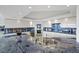 Modern kitchen with white cabinets, granite counters, stainless steel appliances, and a city view at 3111 Bel Air Dr # 21A & 21C, Las Vegas, NV 89109