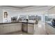 Open concept kitchen features granite countertops and a spacious layout with city views at 3111 Bel Air Dr # 21A & 21C, Las Vegas, NV 89109