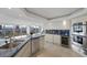 Bright kitchen with stainless steel appliances, a wine fridge, and stunning city views at 3111 Bel Air Dr # 21A & 21C, Las Vegas, NV 89109