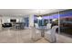 Open concept living and dining area with a bar area and a stunning city view at 3111 Bel Air Dr # 21A & 21C, Las Vegas, NV 89109