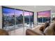 Living room with sliding glass doors opening to a balcony and showcasing a vibrant city view at 3111 Bel Air Dr # 21A & 21C, Las Vegas, NV 89109