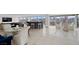 Modern condo living room featuring a granite bar, sitting area, and dining area with a city view at 3111 Bel Air Dr # 21A & 21C, Las Vegas, NV 89109