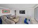 Spacious living room boasts recessed lighting, a large flat screen TV, and comfortable seating at 3111 Bel Air Dr # 21A & 21C, Las Vegas, NV 89109