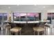 Modern condo living room featuring a granite bar with a spectacular city view at sunset at 3111 Bel Air Dr # 21A & 21C, Las Vegas, NV 89109