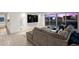 Bright living room features large windows with city views, and a comfortable gray sofa at 3111 Bel Air Dr # 21A & 21C, Las Vegas, NV 89109