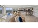 Open-concept living room with panoramic city views, stylish furniture, and adjacent kitchen and bar area at 3111 Bel Air Dr # 21A & 21C, Las Vegas, NV 89109