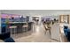 Open floor plan with granite bar, seating, furniture and city views at 3111 Bel Air Dr # 21A & 21C, Las Vegas, NV 89109