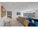 Open-concept living area with city views, comfortable seating, and a large flat screen TV at 3111 Bel Air Dr # 21A & 21C, Las Vegas, NV 89109