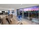 Elegant living area with floor-to-ceiling windows, showcasing stunning views of the city skyline at night at 3111 Bel Air Dr # 21A & 21C, Las Vegas, NV 89109