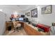 Comfortable office area with wood cabinets, desk, and wall decorations at 3111 Bel Air Dr # 21A & 21C, Las Vegas, NV 89109