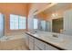 Bathroom featuring a large vanity with double sinks, a tub, and a separate shower at 3127 Kennewick Dr, Las Vegas, NV 89121