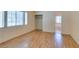 Bedroom featuring wood laminate floors, closet, and ensuite bathroom with tub at 3127 Kennewick Dr, Las Vegas, NV 89121