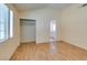 Spacious bedroom featuring light laminate floors, a closet, and natural light at 3127 Kennewick Dr, Las Vegas, NV 89121