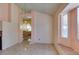 Dining area featuring a hanging light fixture and access to the kitchen, adjacent to the living room at 3127 Kennewick Dr, Las Vegas, NV 89121