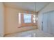 Sunlit dining area with a built-in window seat and modern light fixture, great for Gathering meals at 3127 Kennewick Dr, Las Vegas, NV 89121