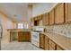 Kitchen featuring tiled countertops, tile backsplash, and white appliances at 3127 Kennewick Dr, Las Vegas, NV 89121
