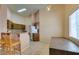 Kitchen and breakfast bar with tiled floors, backsplash, and natural light at 3127 Kennewick Dr, Las Vegas, NV 89121