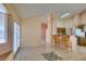 Bright living area with tiled floors, breakfast bar, and a sliding glass door at 3127 Kennewick Dr, Las Vegas, NV 89121