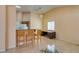 Bright living area with tiled floors, a breakfast bar, and a home office area at 3127 Kennewick Dr, Las Vegas, NV 89121
