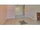 A spacious living room featuring stylish tile floors, a decorative tile insert, and a tiered floor design at 3127 Kennewick Dr, Las Vegas, NV 89121