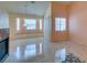Living room with lots of natural light from windows, fireplace and tile floors at 3127 Kennewick Dr, Las Vegas, NV 89121
