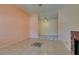 Inviting living room features decorative tile flooring, a brick fireplace, and soft, neutral wall tones at 3127 Kennewick Dr, Las Vegas, NV 89121