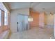 This open living space features stylish tile floors, a hanging light fixture, and a sliding glass door at 3127 Kennewick Dr, Las Vegas, NV 89121