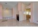 Open-concept living space with a fireplace and adjacent bar, great for entertaining at 3127 Kennewick Dr, Las Vegas, NV 89121