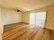 Bright room featuring wood-look floors, a ceiling fan, and sliding glass doors leading to outdoor space at 3270 Liahona Way, Las Vegas, NV 89121