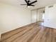 Bedroom featuring modern ceiling fan, mirrored closet doors, and vinyl wood flooring at 3270 Liahona Way, Las Vegas, NV 89121