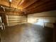Spacious two car garage with concrete floor and exposed wood beam ceiling at 3270 Liahona Way, Las Vegas, NV 89121
