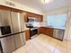 Kitchen featuring stainless steel appliances, tile flooring and a window at 3270 Liahona Way, Las Vegas, NV 89121