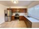Kitchen featuring stainless steel appliances, tile flooring and countertops at 3270 Liahona Way, Las Vegas, NV 89121