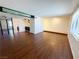 Spacious living room with wood-look flooring and bright, natural light at 3270 Liahona Way, Las Vegas, NV 89121