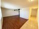 Open-concept living space with wood-look flooring, tile floors, and neutral paint at 3270 Liahona Way, Las Vegas, NV 89121