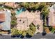 An aerial shot shows the layout of the neighborhood including the house roof, and neighboring lawns at 33 Promontory Ridge Dr, Las Vegas, NV 89135