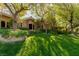 Landscaped yard and stone exterior of home create curb appeal and a welcoming feel at 33 Promontory Ridge Dr, Las Vegas, NV 89135