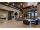 Spacious living area with stone accent wall, fireplace, and seamless indoor-outdoor living at 33 Promontory Ridge Dr, Las Vegas, NV 89135
