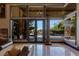 This bright living room features marble floors, large windows with views of the pool, and intricate trim at 33 Promontory Ridge Dr, Las Vegas, NV 89135