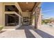 Covered patio with stone pillars, brick flooring, and a view of the pool at 33 Promontory Ridge Dr, Las Vegas, NV 89135