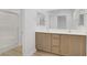 Well-lit bathroom featuring a double sink vanity and walk-in shower at 3621 Arcadian Sea St, Las Vegas, NV 89106
