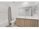 Bright bathroom with shower-tub combo and ample cabinet space at 3621 Arcadian Sea St, Las Vegas, NV 89106