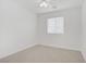 Cozy bedroom with plush carpet, ceiling fan and a window at 3621 Arcadian Sea St, Las Vegas, NV 89106