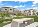 Community common area with picnic tables and green space for relaxing at 3621 Arcadian Sea St, Las Vegas, NV 89106
