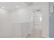 Upstairs hallway offers access to bedrooms and features fresh paint and plush carpeting at 3621 Arcadian Sea St, Las Vegas, NV 89106