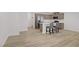 Open-concept kitchen boasts stainless appliances, quartz countertops and a breakfast bar at 3621 Arcadian Sea St, Las Vegas, NV 89106