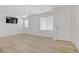 Bright living room with wood-look floors and a modern ceiling fan at 3621 Arcadian Sea St, Las Vegas, NV 89106