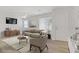 Bright living room featuring modern furniture, neutral tones, and a cozy atmosphere, virtually staged at 3621 Arcadian Sea St, Las Vegas, NV 89106