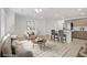Open-concept living room flows into the kitchen with bar seating, creating a welcoming space, virtually staged at 3621 Arcadian Sea St, Las Vegas, NV 89106